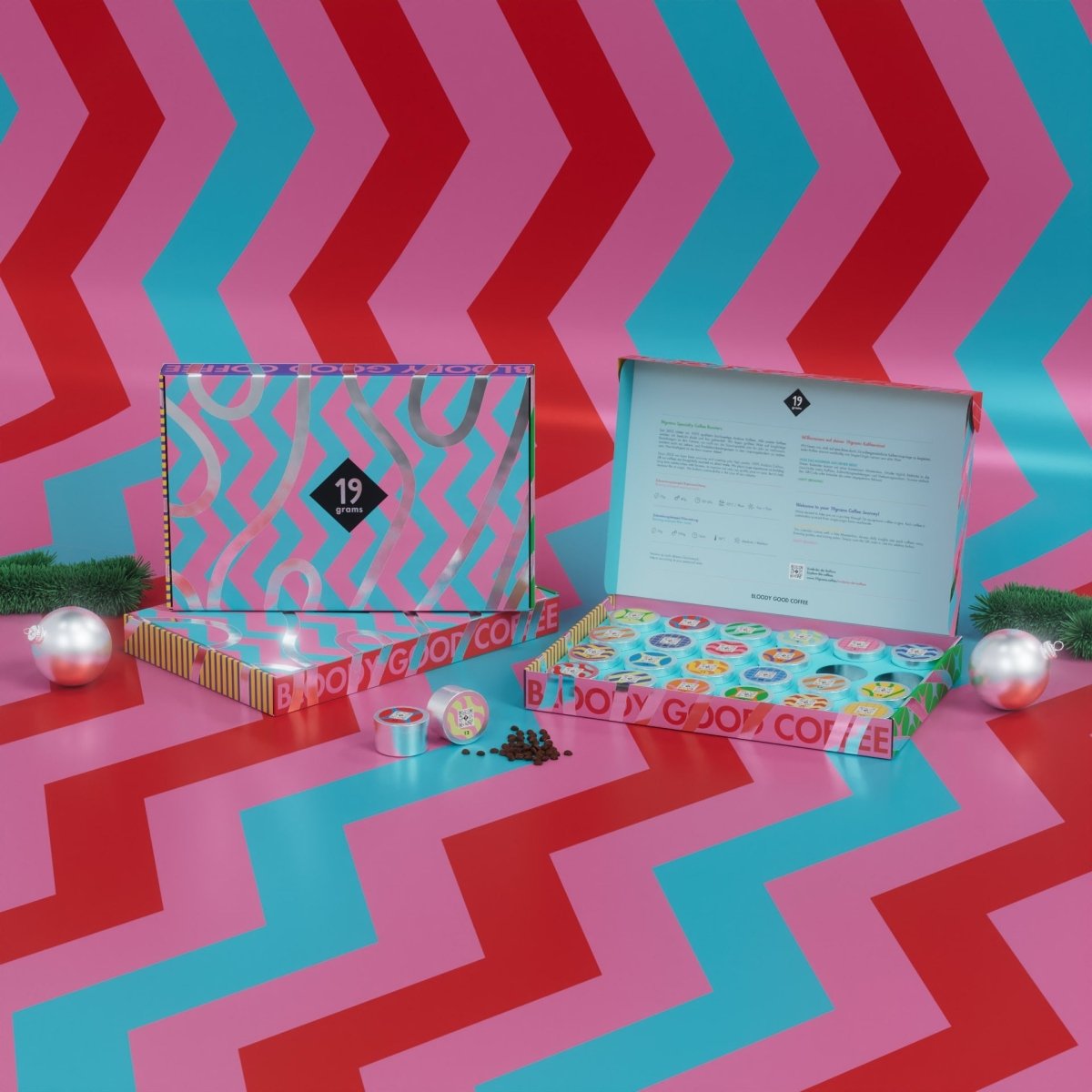 19grams Bloody Good Coffee Adventskalender 2025 – geöffnete Box mit bunten Dosen und 19grams Tragetasche